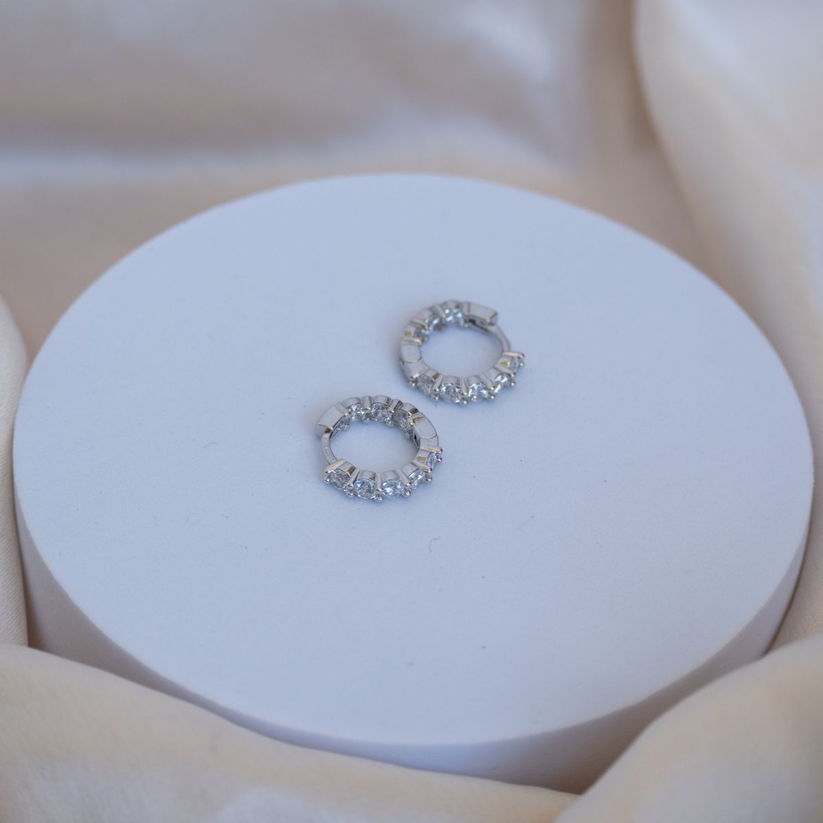 Silver Huggy earrings with Zirconia detail on front sides