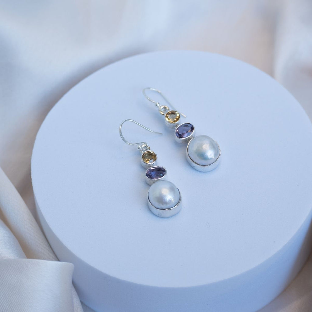 Three drop earrings with Amethyst and Citrine and a freshwater pearl in the drop