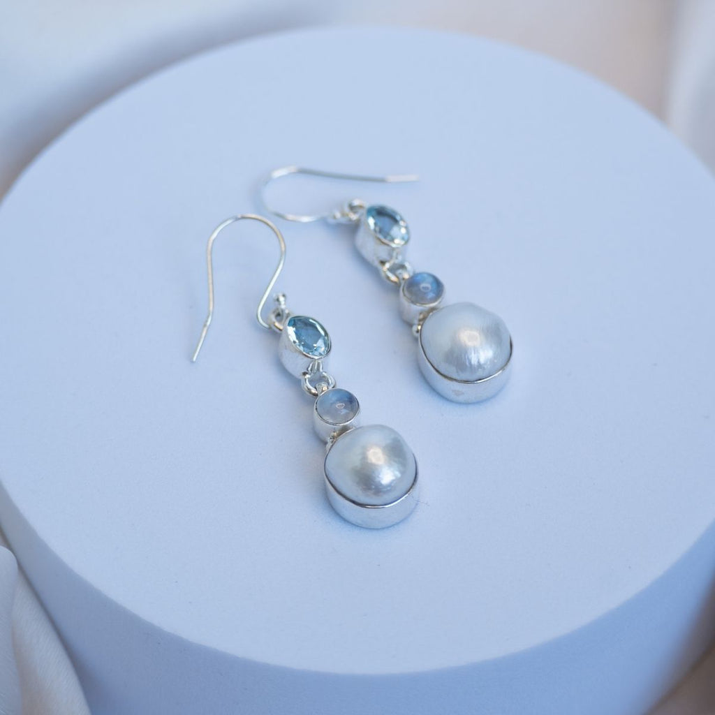 Three drop earrings with blue topaz, moonstone and freshwater pearl drop