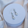 Three drop earrings with blue topaz, moonstone and freshwater pearl drop