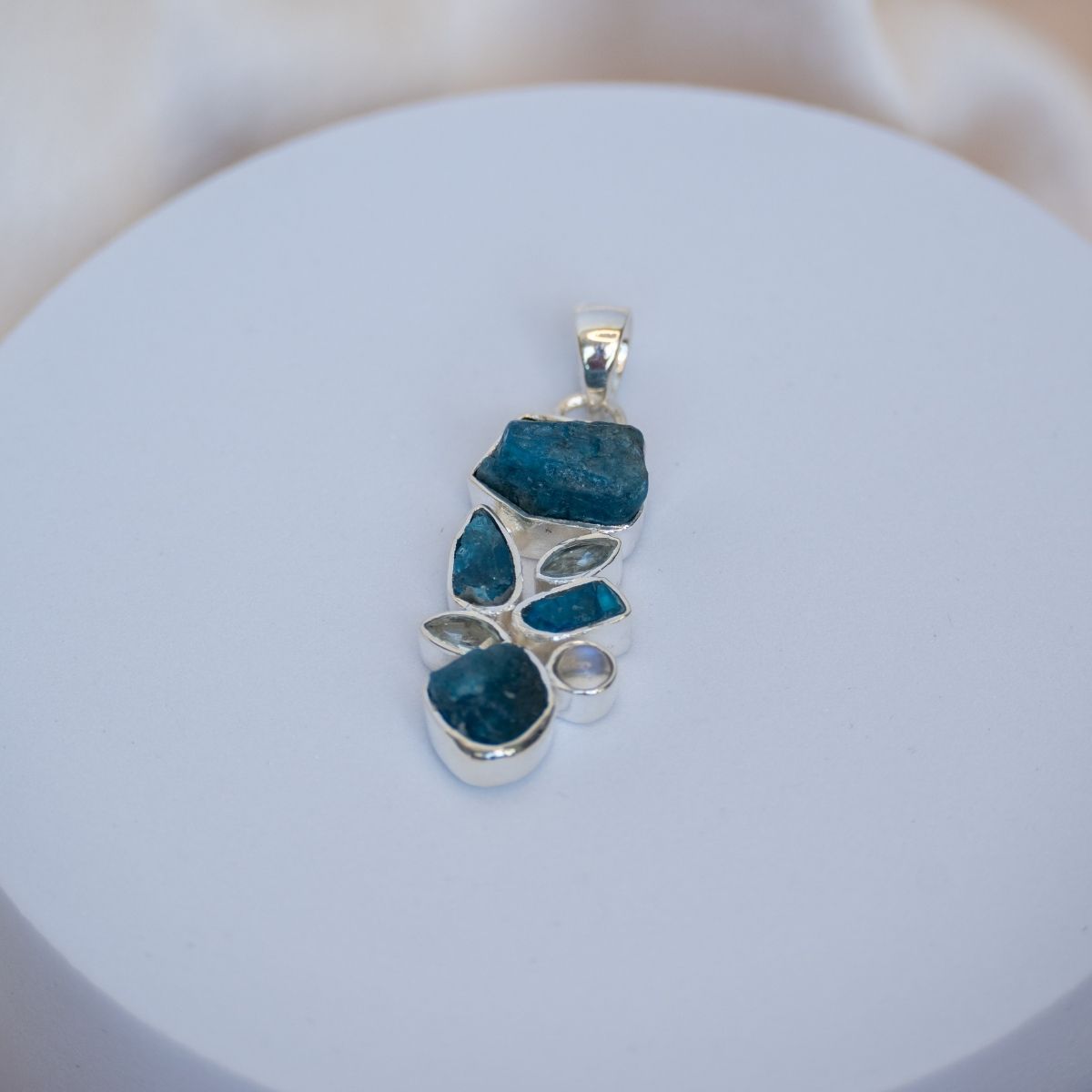 Pendant with a cluster of Raw Blue apatite and other light semi precious stones