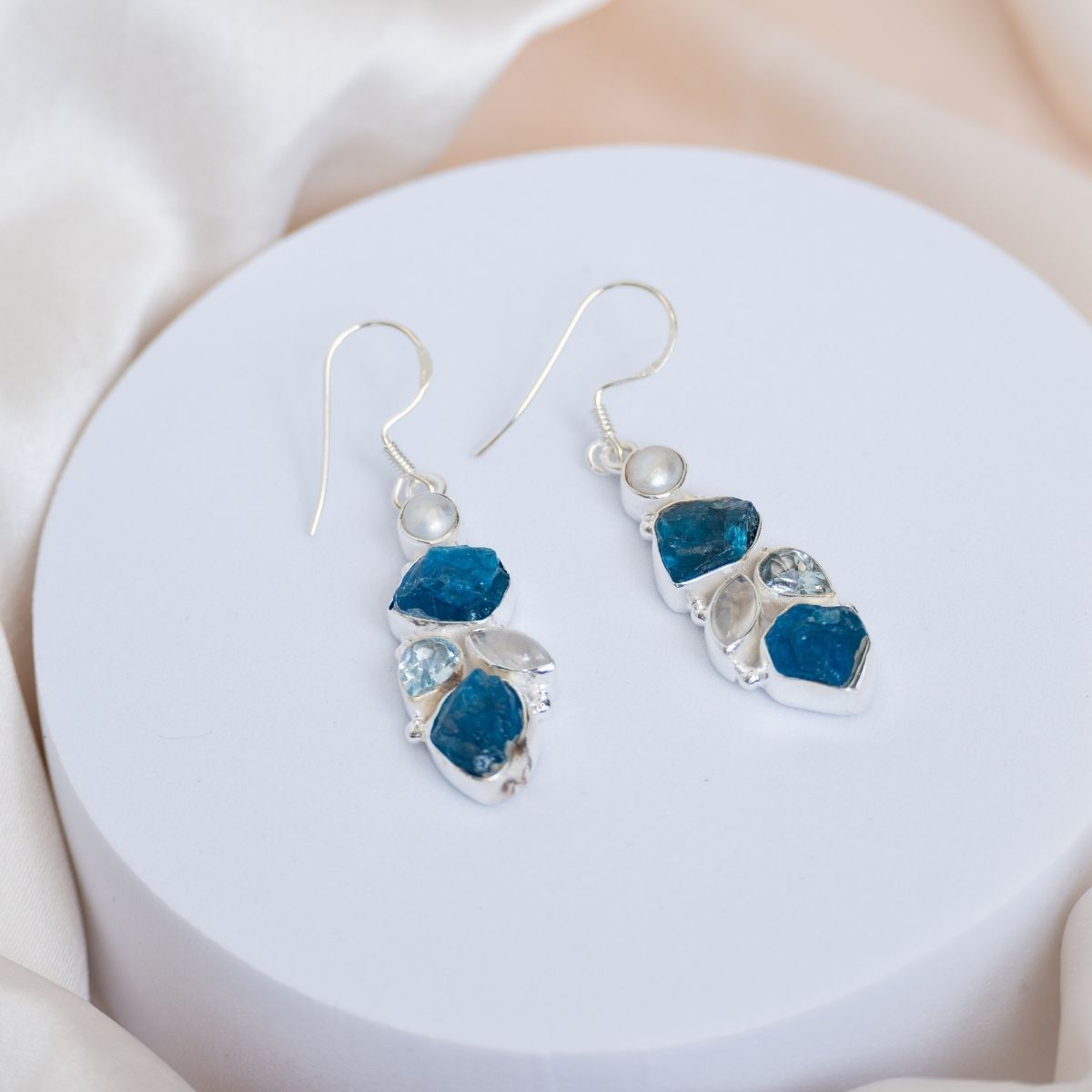 Blue Apatite, moonstone, blue topaz and a freshwater pearl drop earring