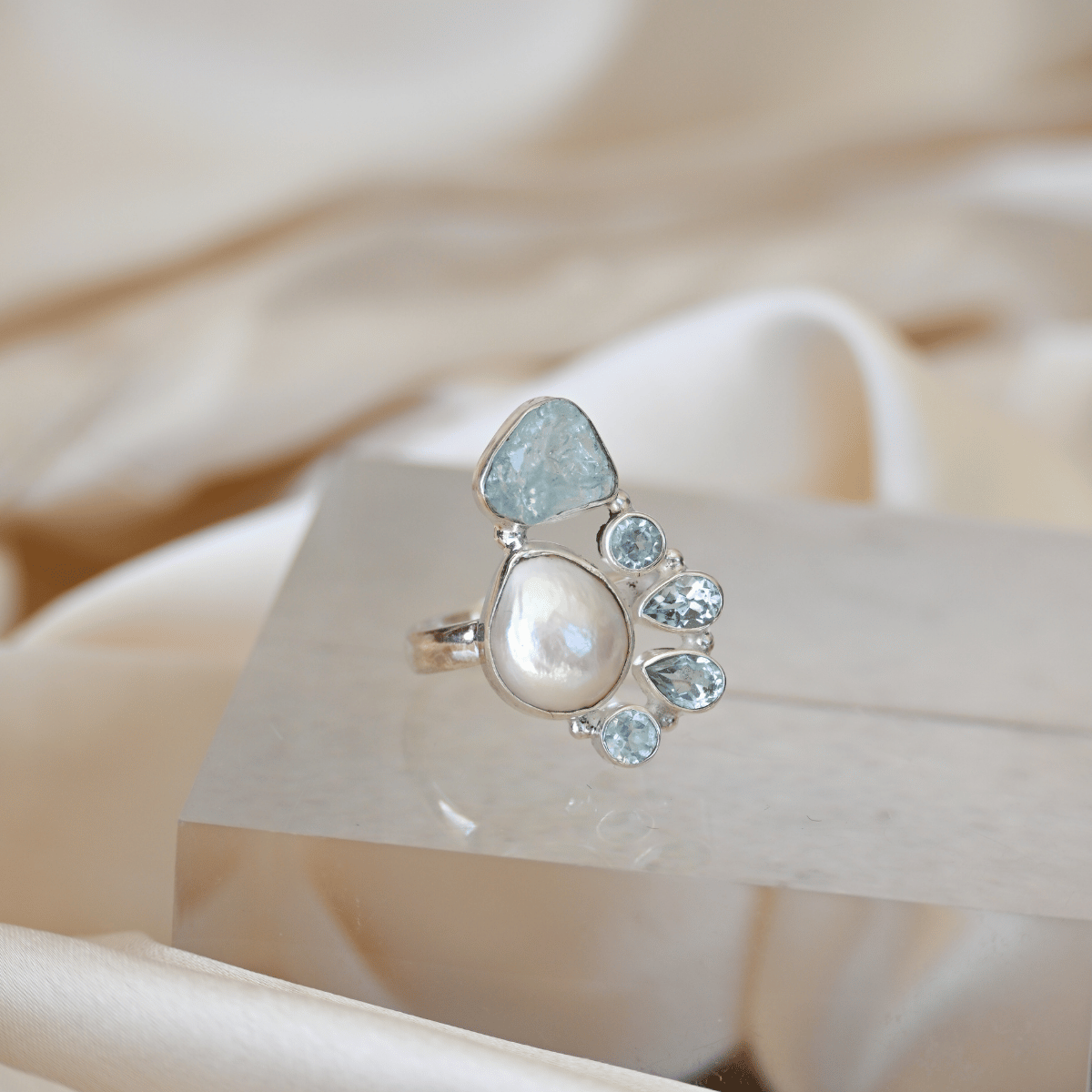 Freshwater pearl and blue topaz semi precious stone ring