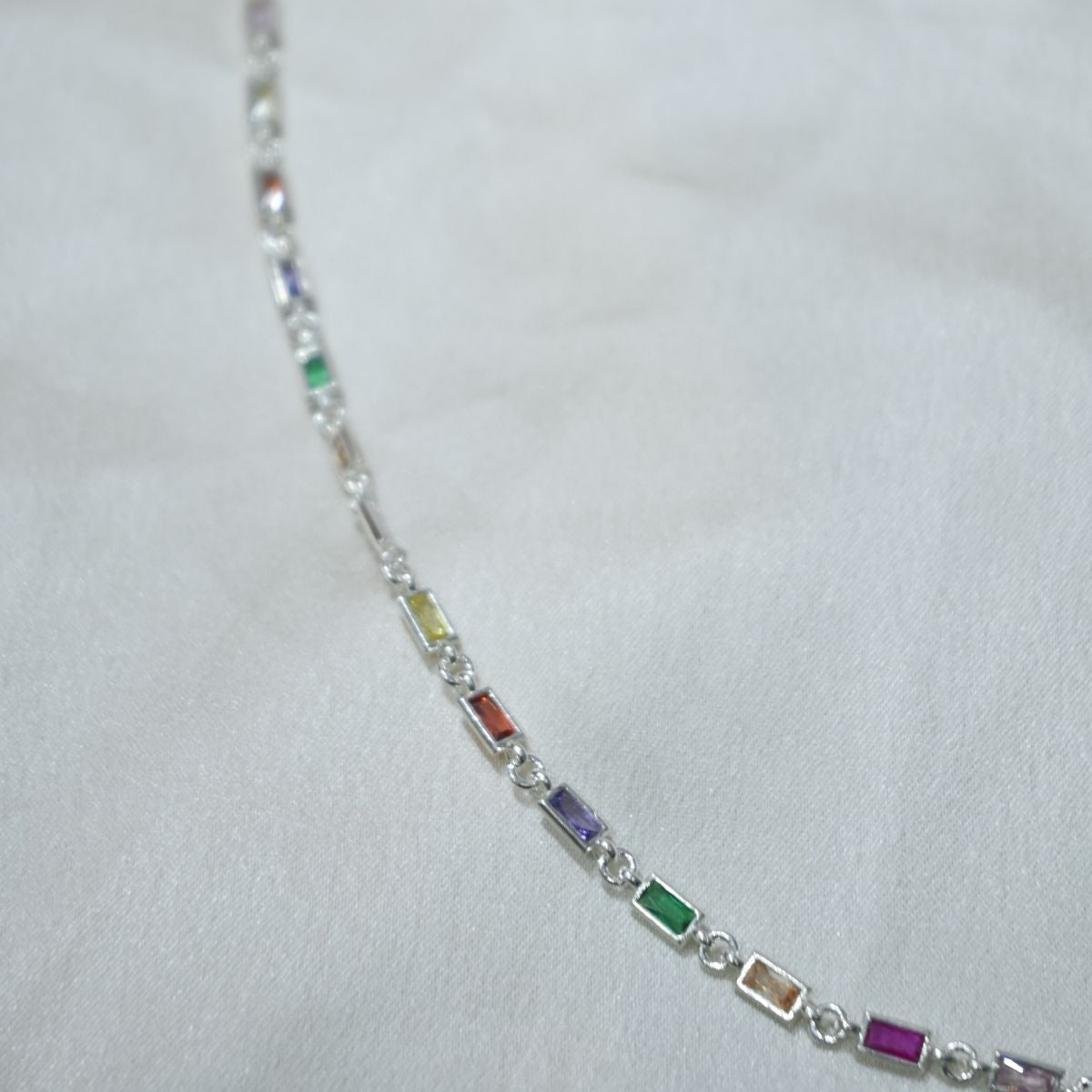 Multicolored gemstone bracelet on a white background