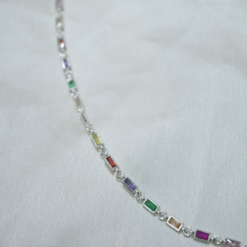 Multicolored gemstone bracelet on a white background