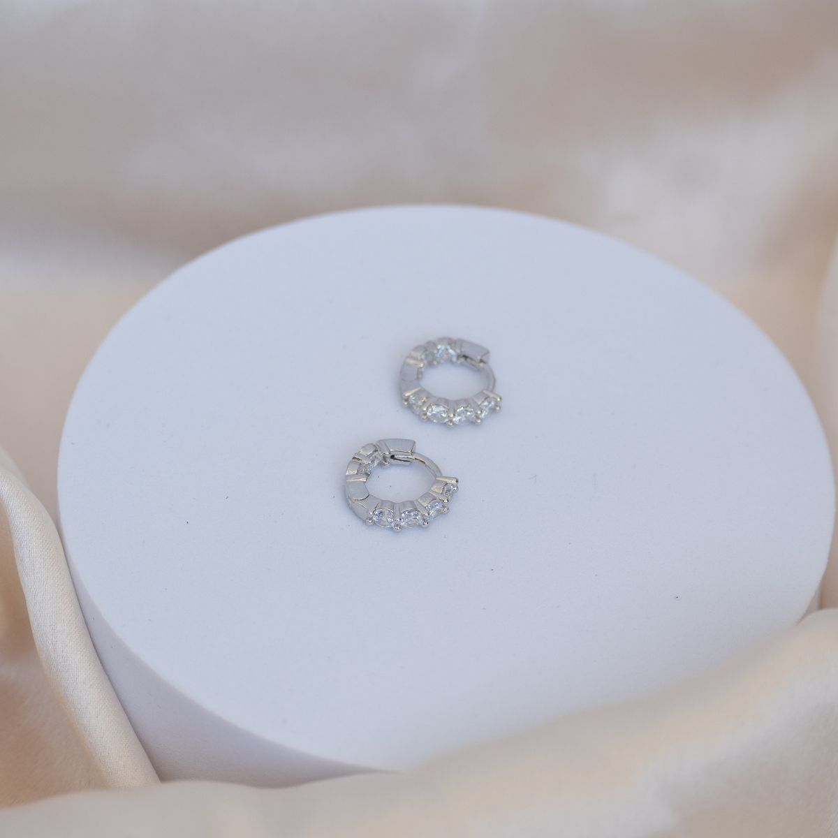 Silver Huggy earrings with Zirconia detail on front sides