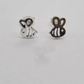 A pair of sterling silver bee stud earrings on a white background.