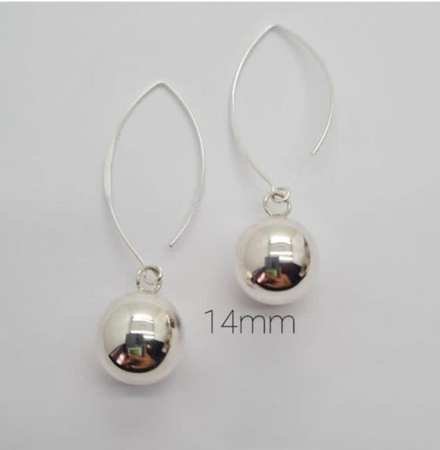 A pair of sterling silver 14mm hanging ball earrings displayed against a white background.