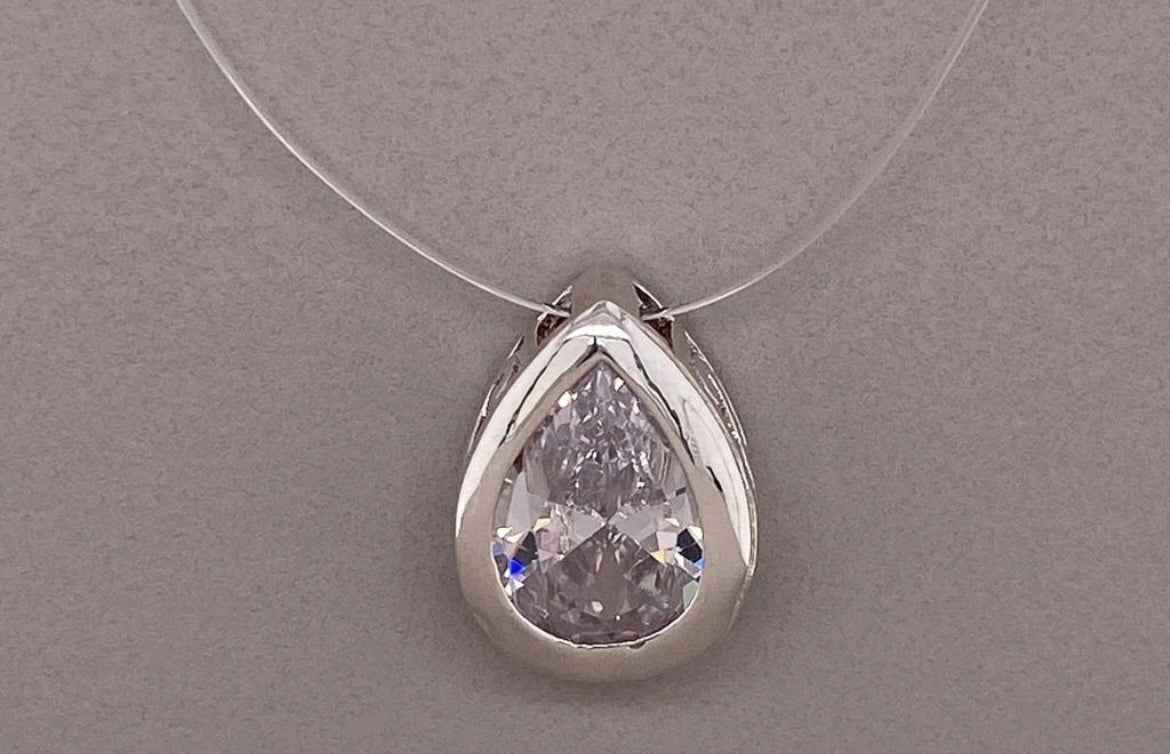 Large Floating teardrop in gut with stunning filigree detail on side