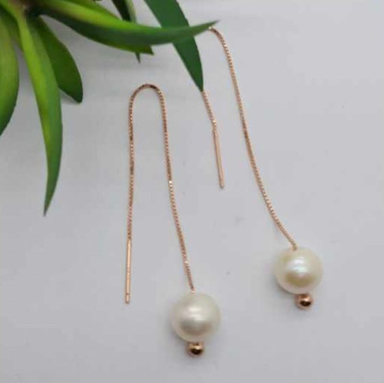 Rose gold chain earrings with freshwater pearl on end